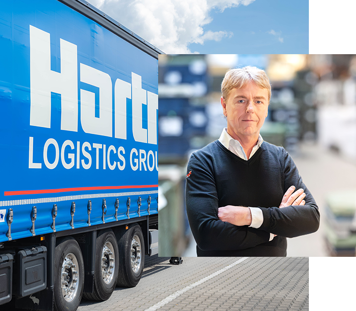 Porträt eines Managers von Hartmann Logistics Group vor einem Lkw